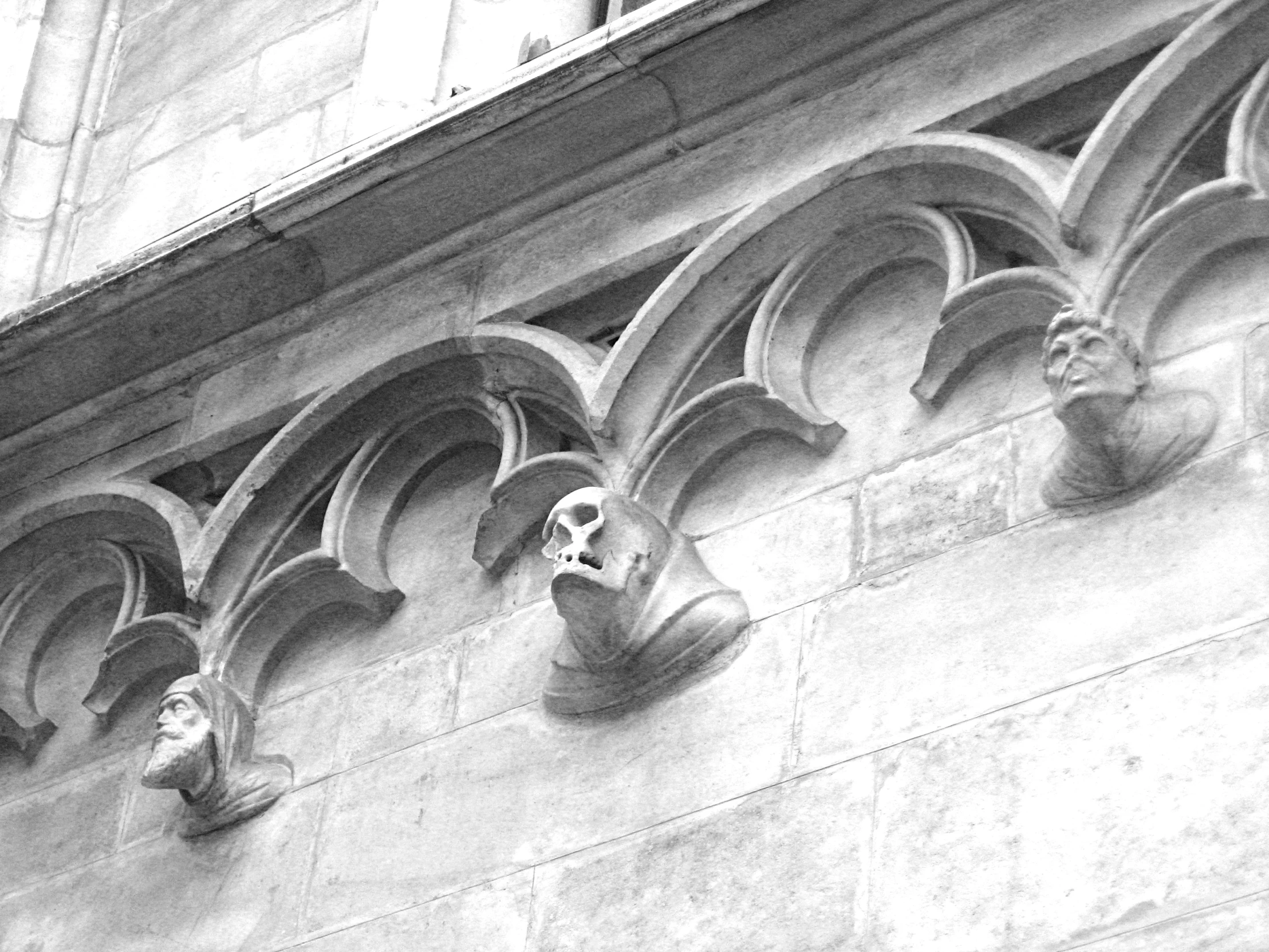 an architecturally detailed building has many small gargoyles on it