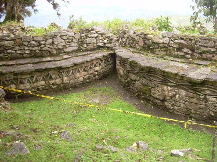 two ruins that have been built in a small pit