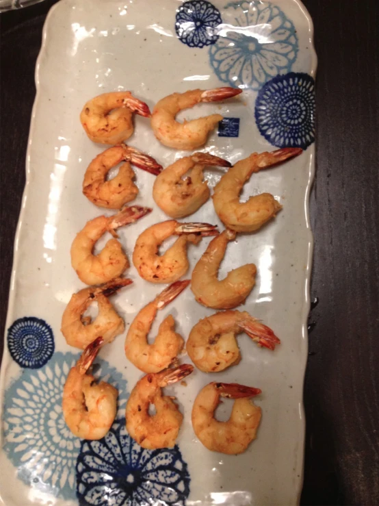 large serving platter with cooked shrimp on it