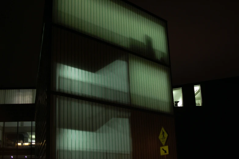 blurry image of building on street during night time