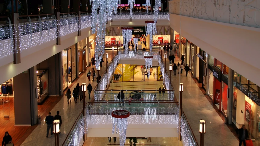 an aerial view of a building with many people walking around