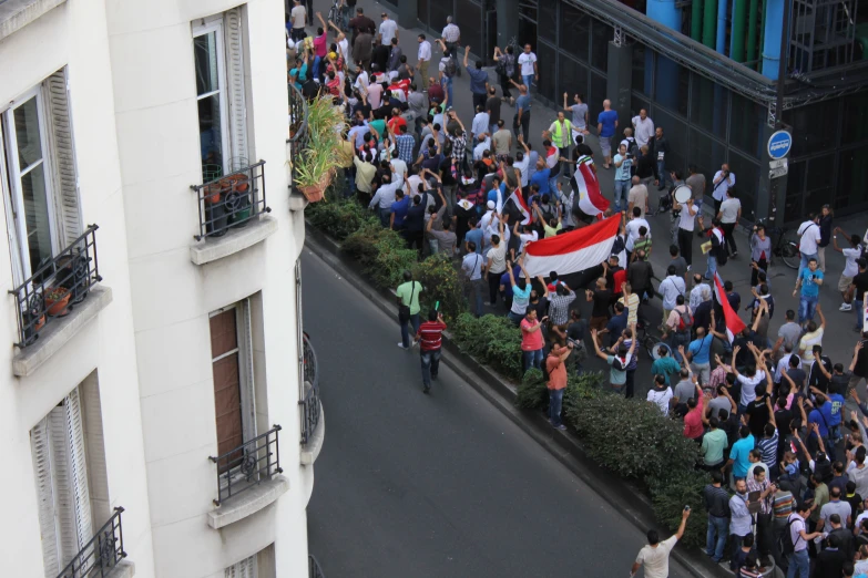 a crowd of people on the street in a city