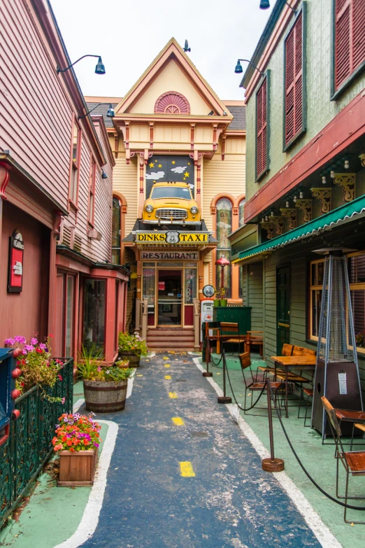 a small restaurant and walkway near many buildings