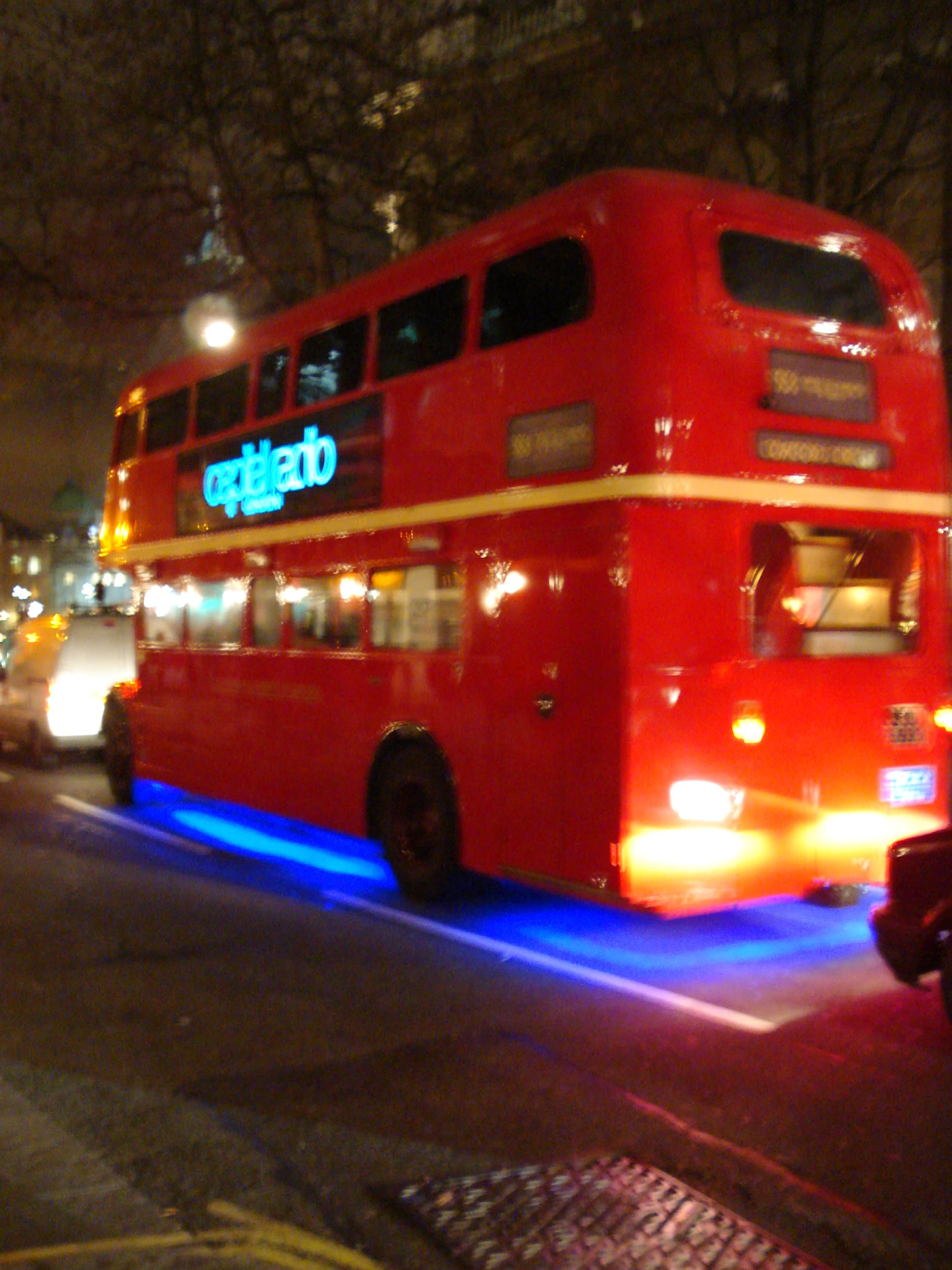 a double decker bus driving down the road