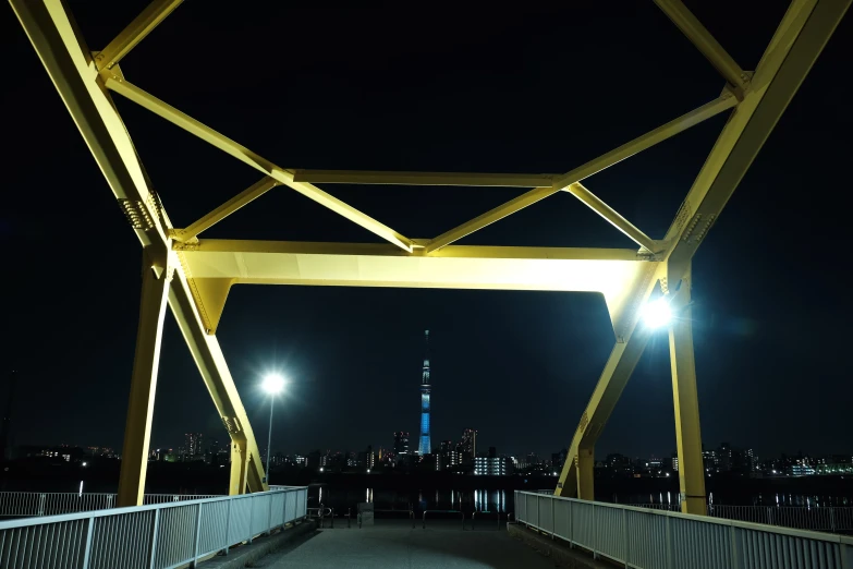 a large long bridge with lights on at night