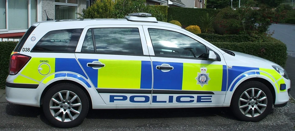 a small police car in a residential area