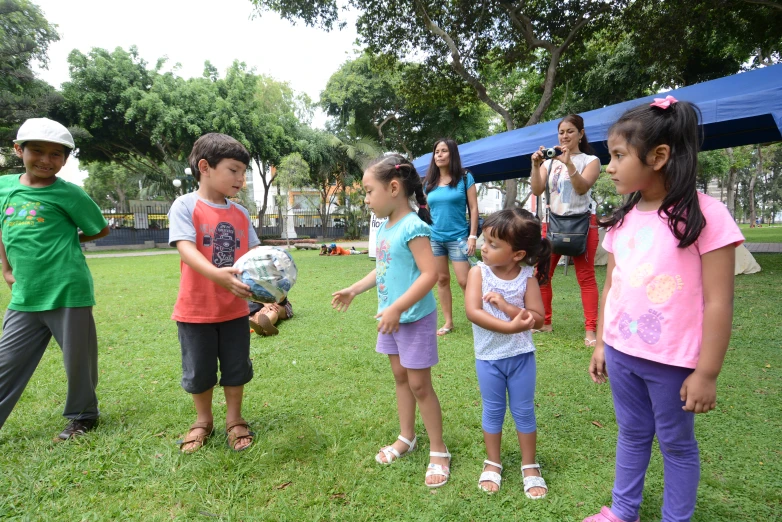 a group of children standing next to each other