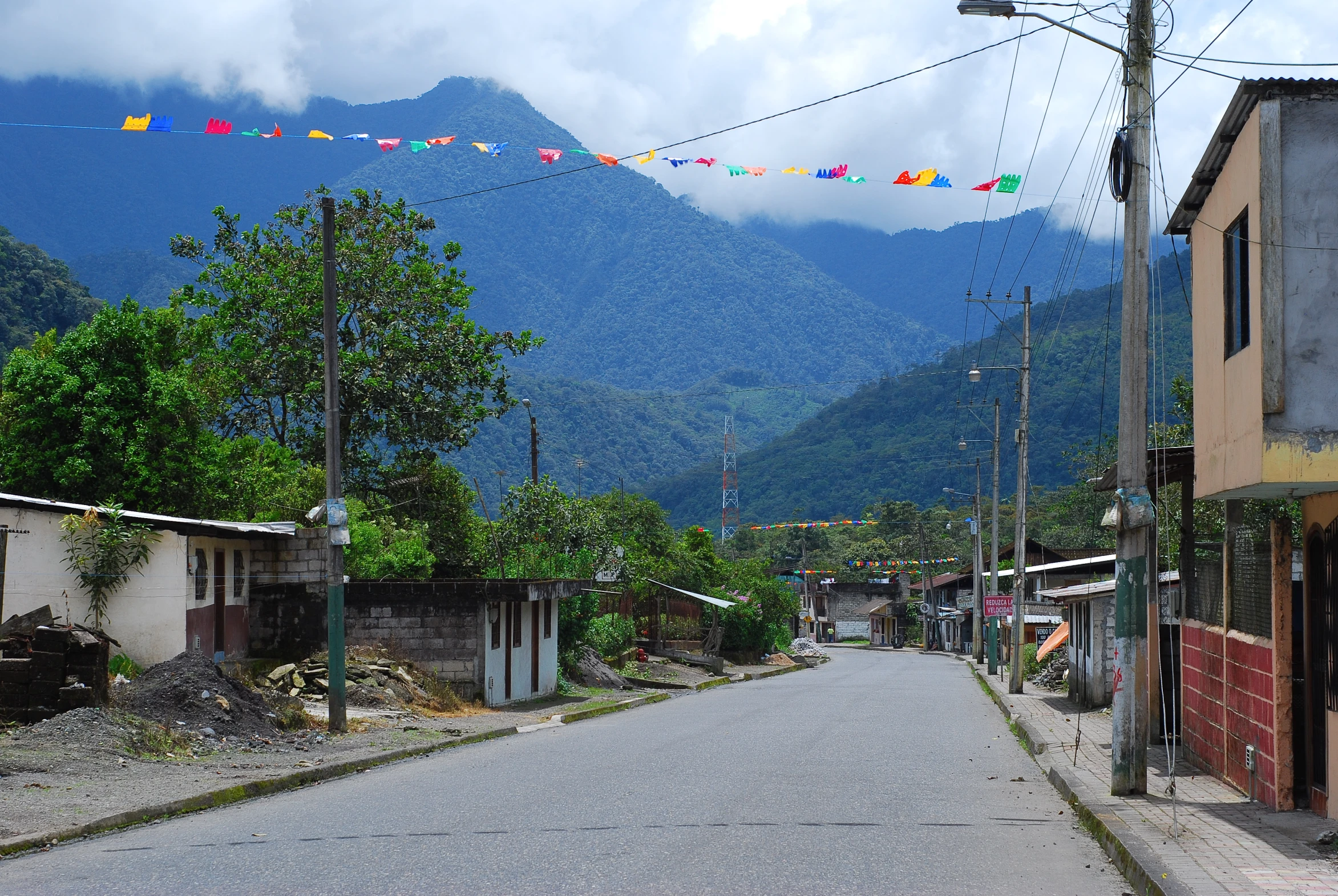 a narrow street lined with lots of houses