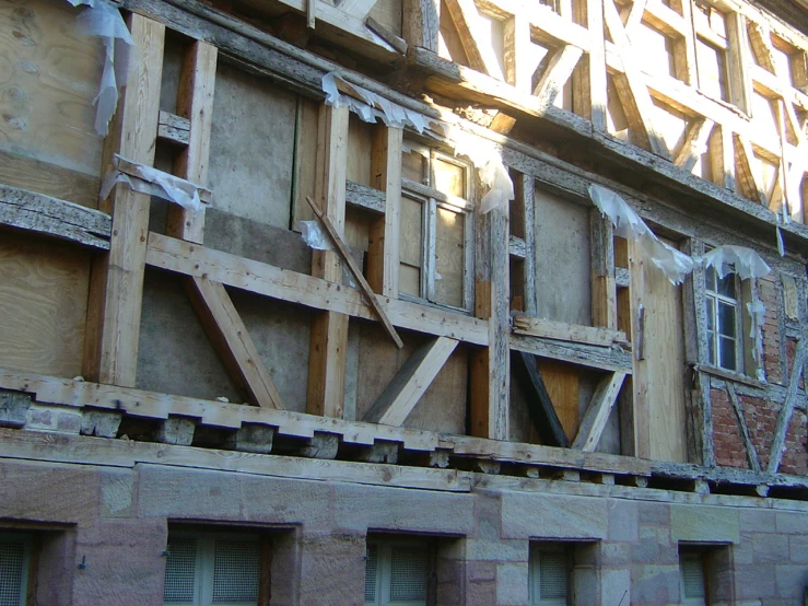 some type of building being built with wood frame around it