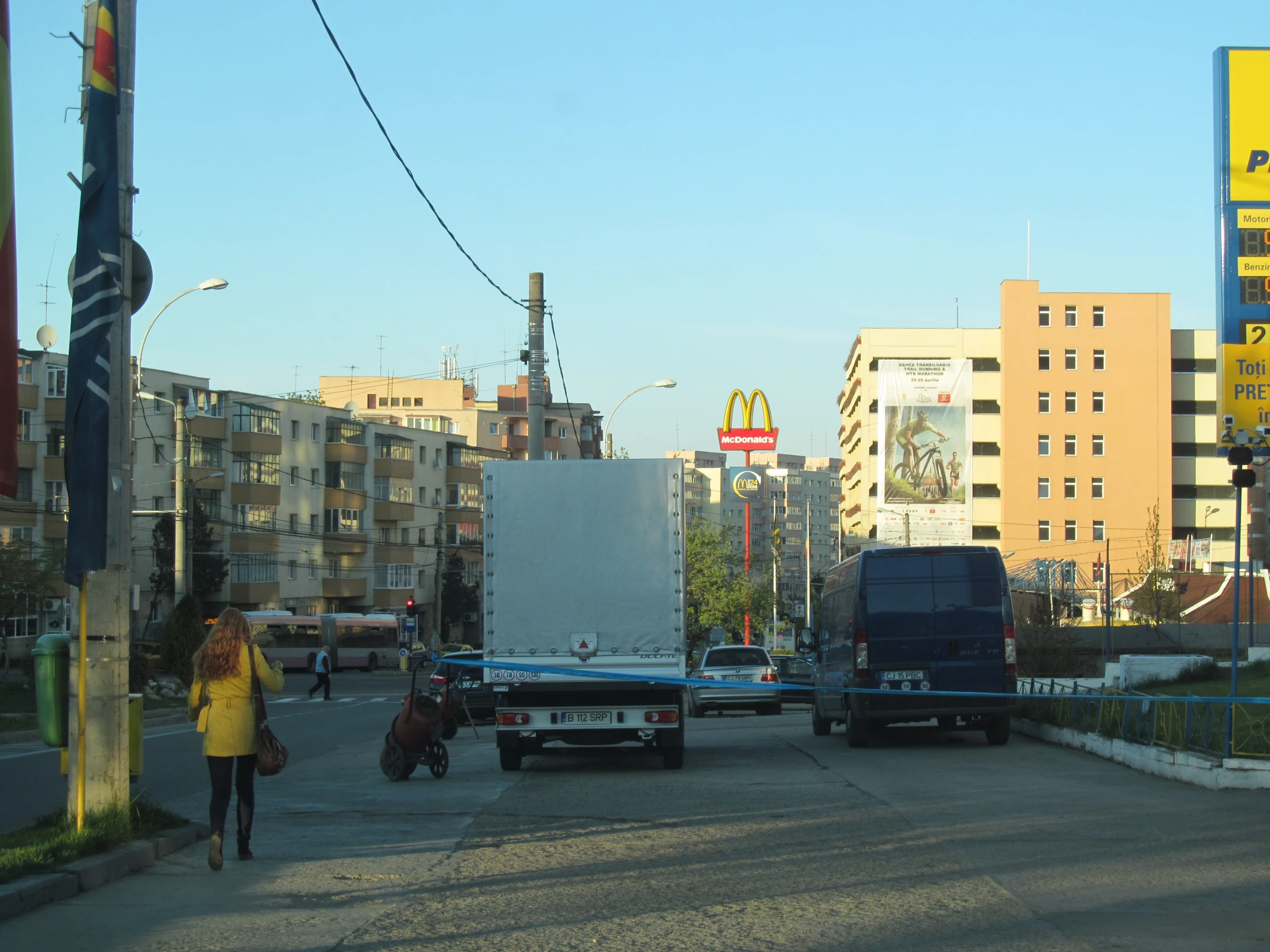 the traffic on this city street has large trucks