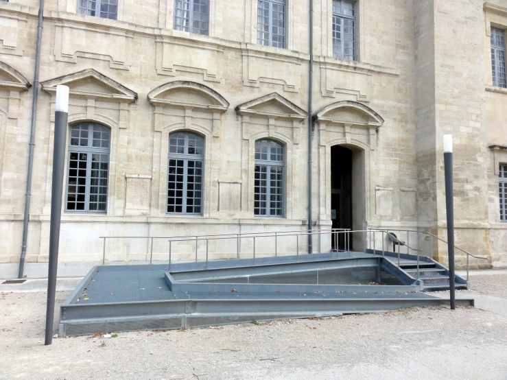 a building with some windows and some stairs