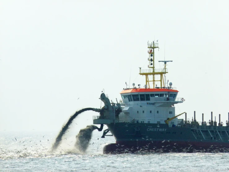 large boat in the ocean with an orange roof