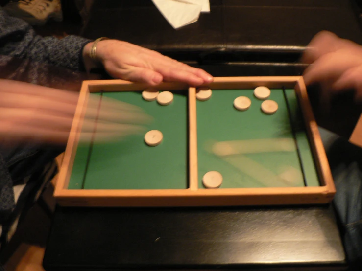 two people playing a game with a matching table
