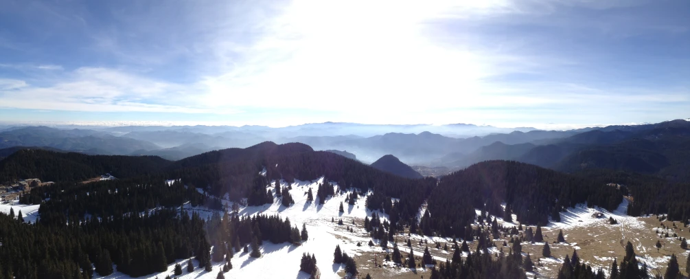 the view of the top of a ski resort with a view of the mountains