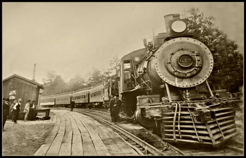 an antique po of a train near a train station