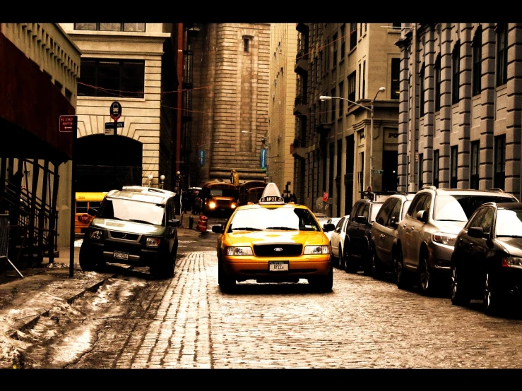 cars on a city street in front of buildings