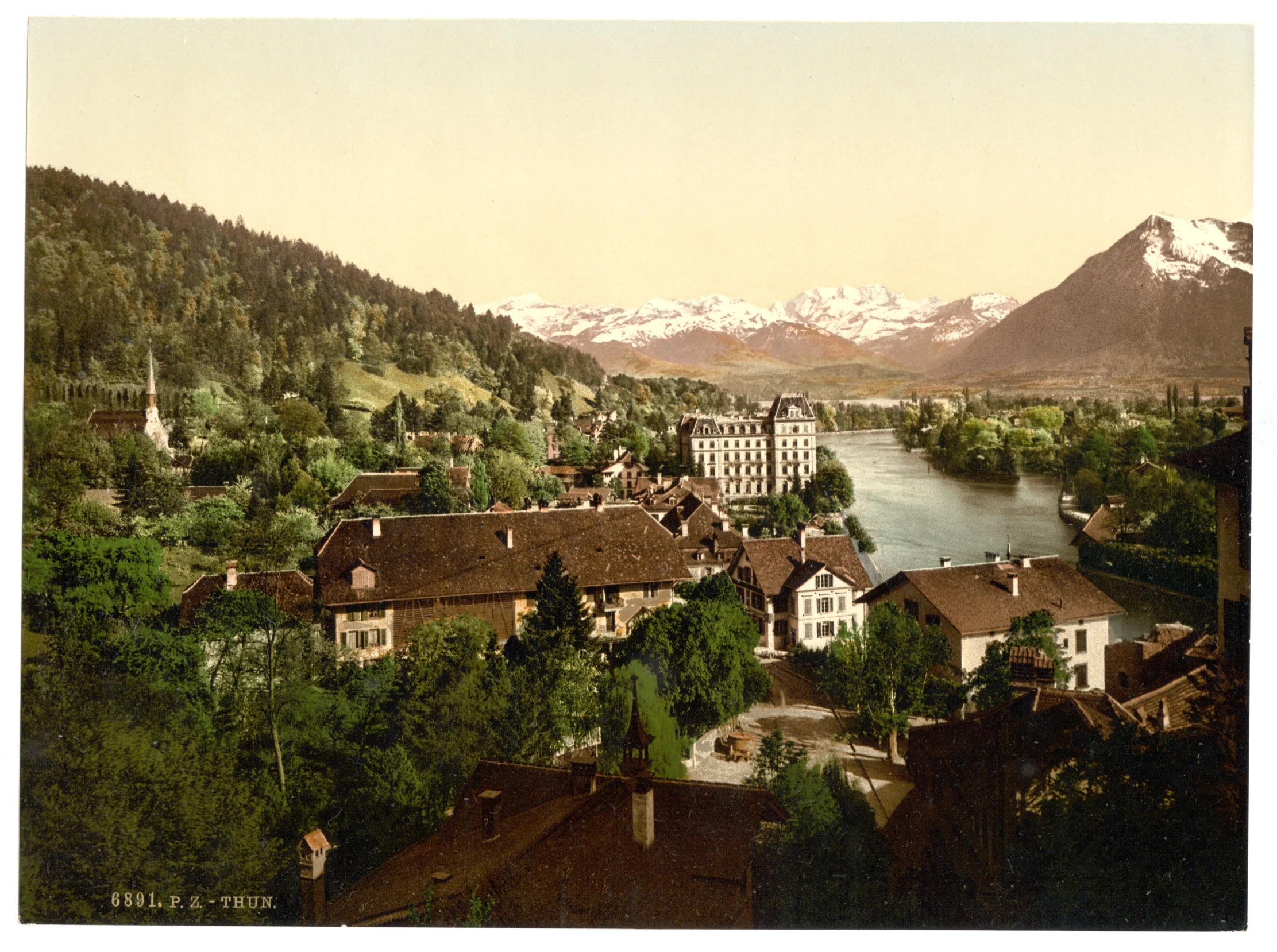 a vintage po of a beautiful city surrounded by mountains