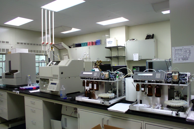 laboratory equipment and cabinetd in cabinets filled with chemicals