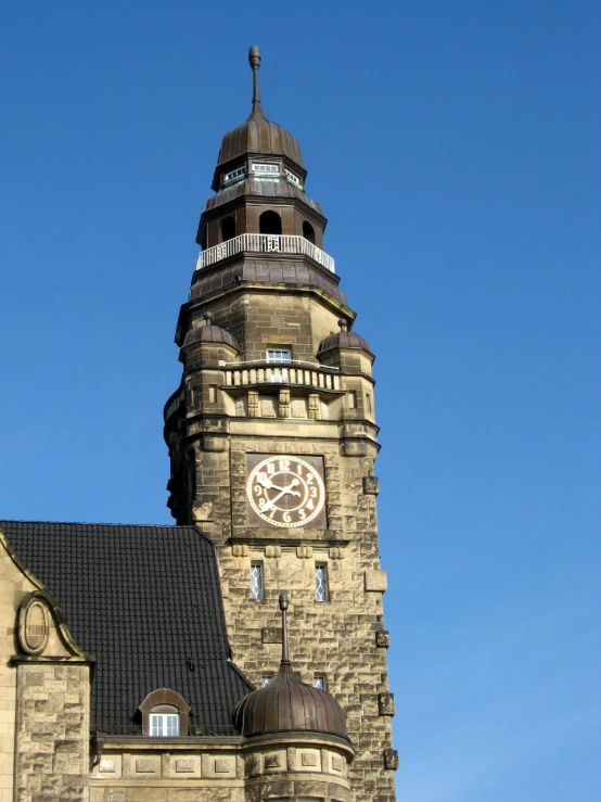 a very big building with a nice clock on it's side