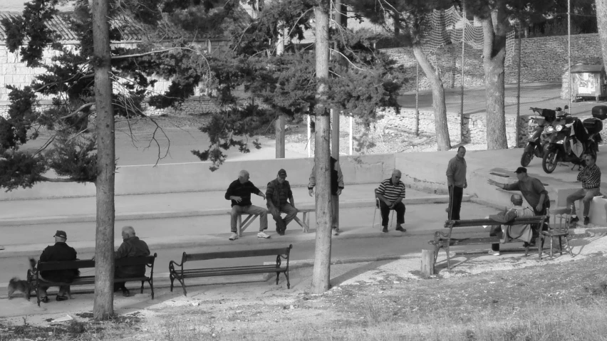 black and white pograph of people walking down the sidewalk