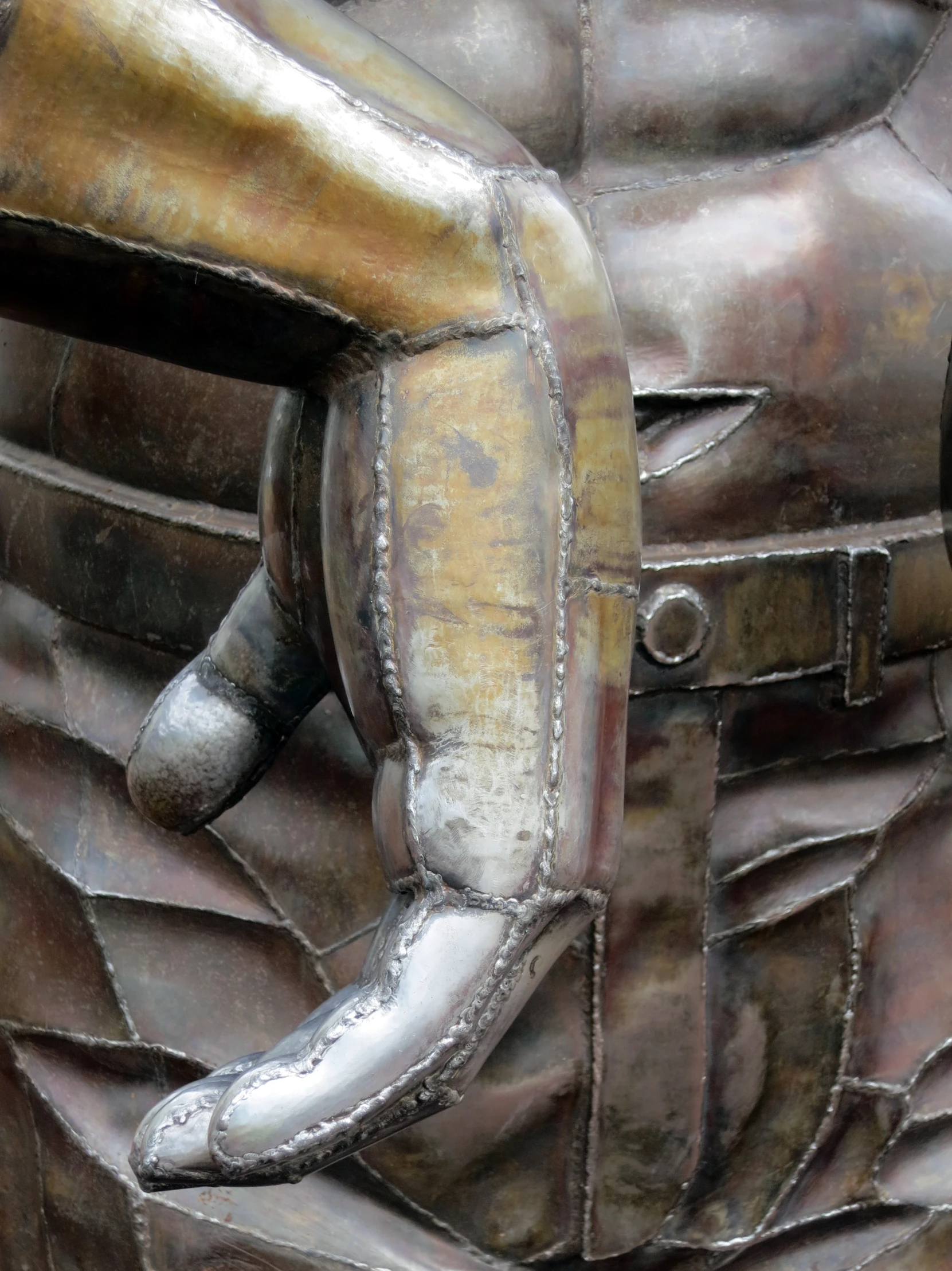 a statue of a baseball player's helmet and arm