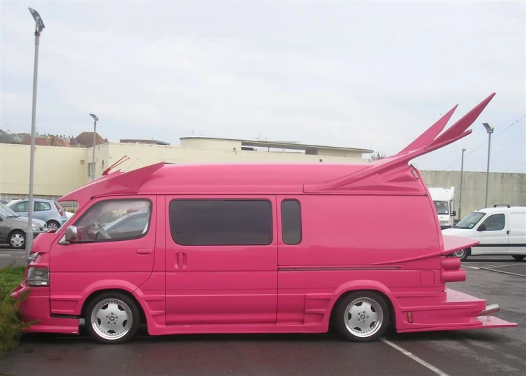 a pink van with a large blade design on it's roof