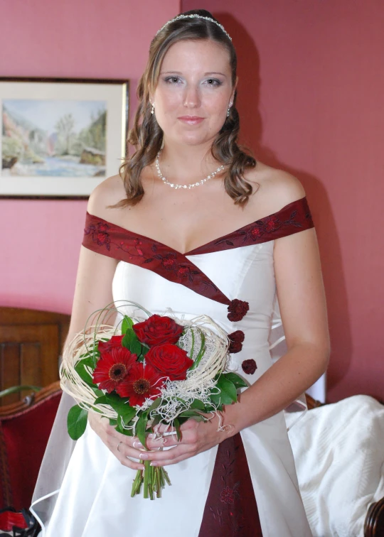 a beautiful bride in an elegant wedding dress holding a bouquet