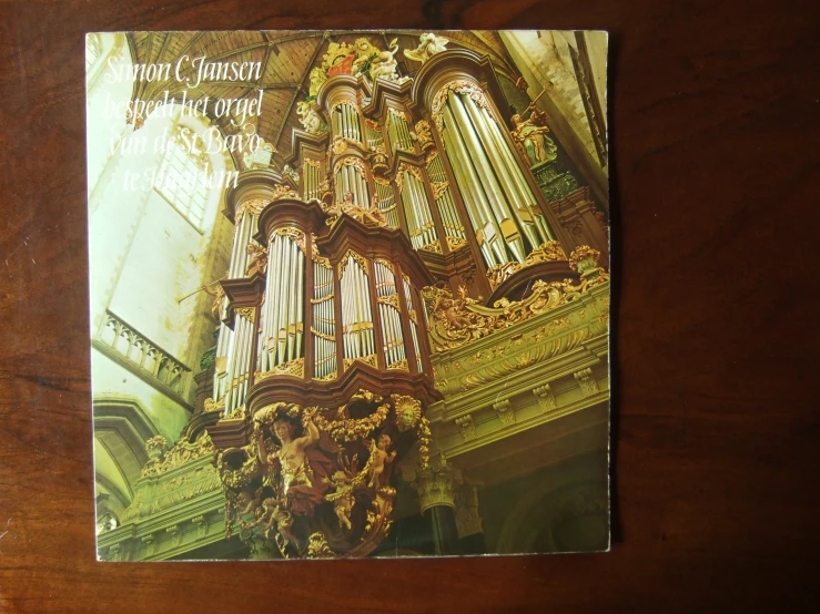 a large pipe organ sitting on top of a wooden table