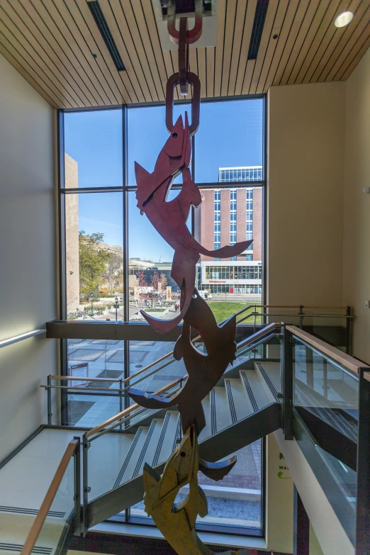 a modern art exhibit sitting on top of an industrial stair case