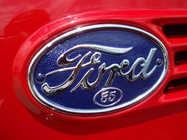 an emblem of ford on the side of a car