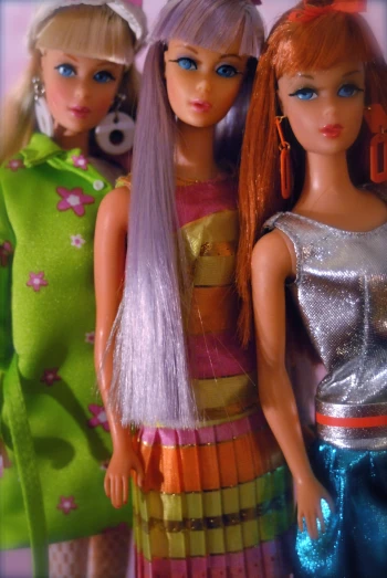 three female dolls are in the same image