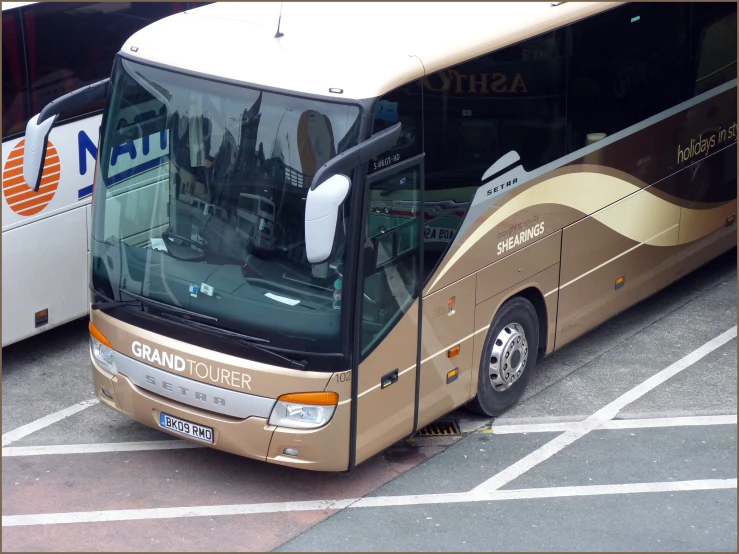 a bus parked at a station with other buses