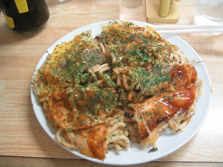 plate of chicken parmesan and pasta with sauce