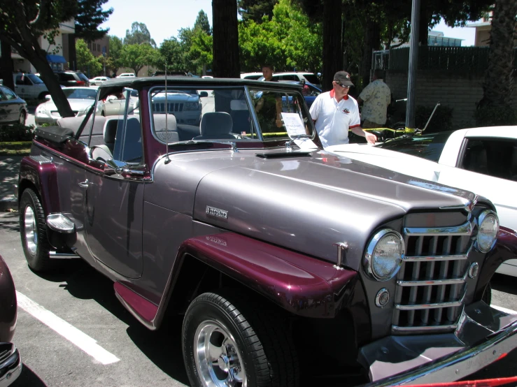 an older fashion looking pickup truck with flatbed