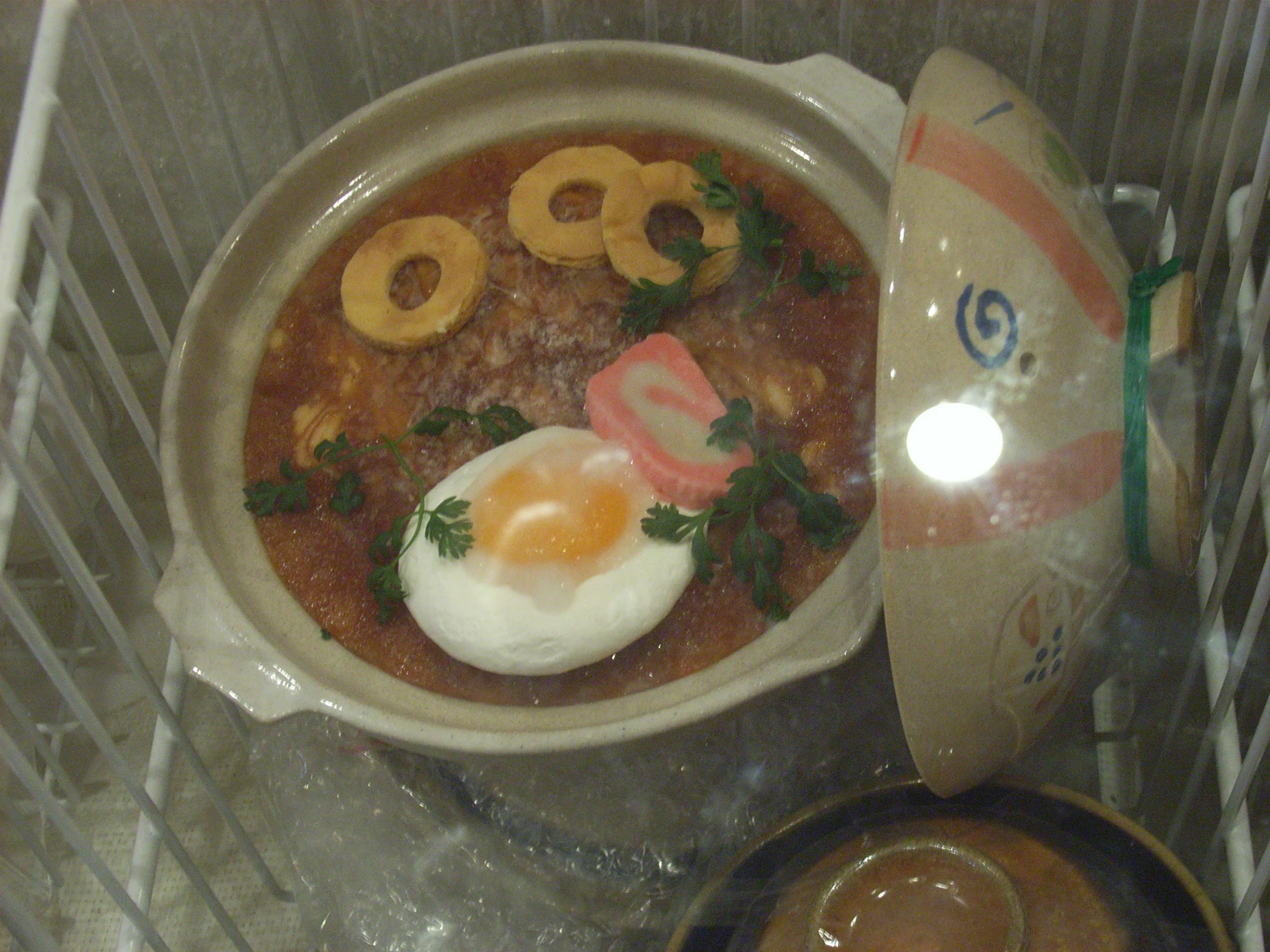 a bowl of food in a glass box