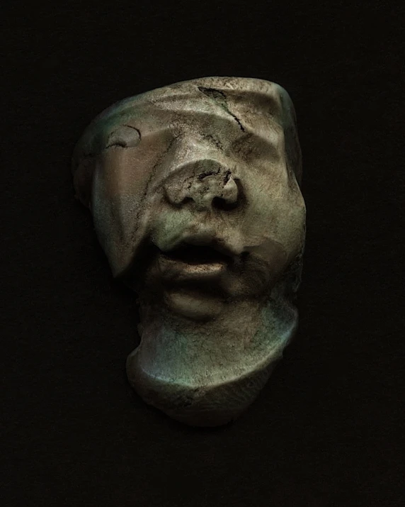 a close up of a face made from plaster