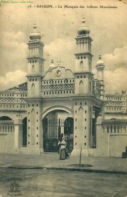 an old po of a large building with many towers