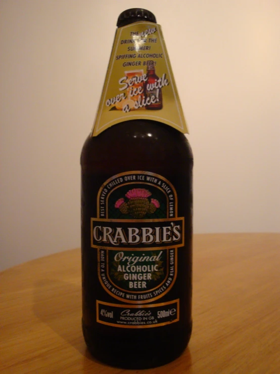 a close up of a bottle of alcohol on a table