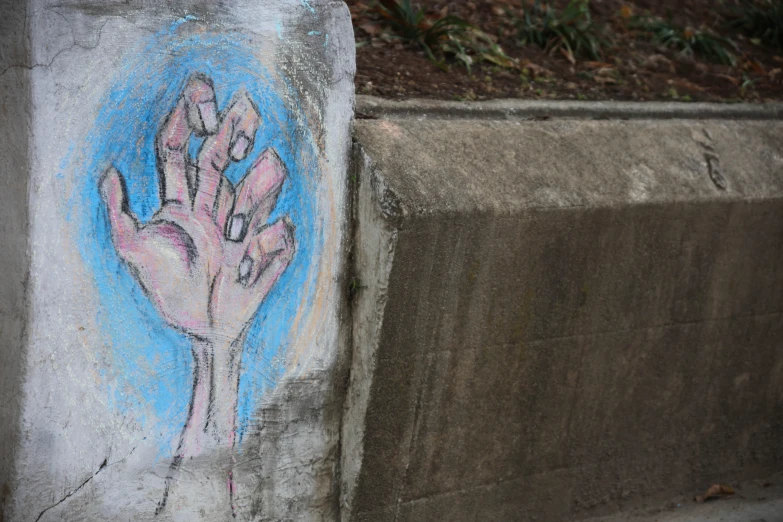 a painting on the side of a cement wall