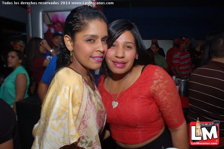 two girls in red shirts and yellow clothes