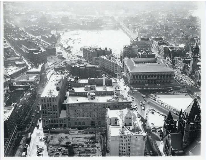 this is a black and white picture of an aerial view of a city in the winter