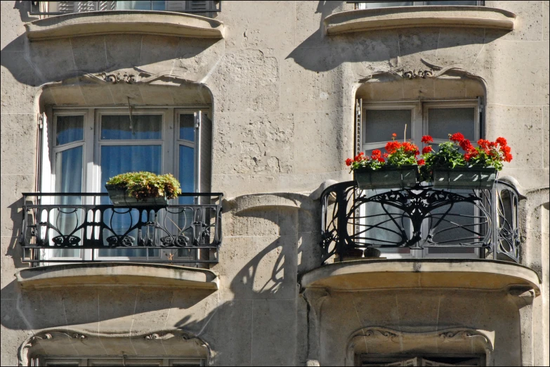balcony with metal balconies on windows and wrought iron railing