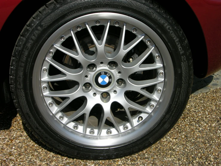 wheel and rim of a vehicle on gravel surface