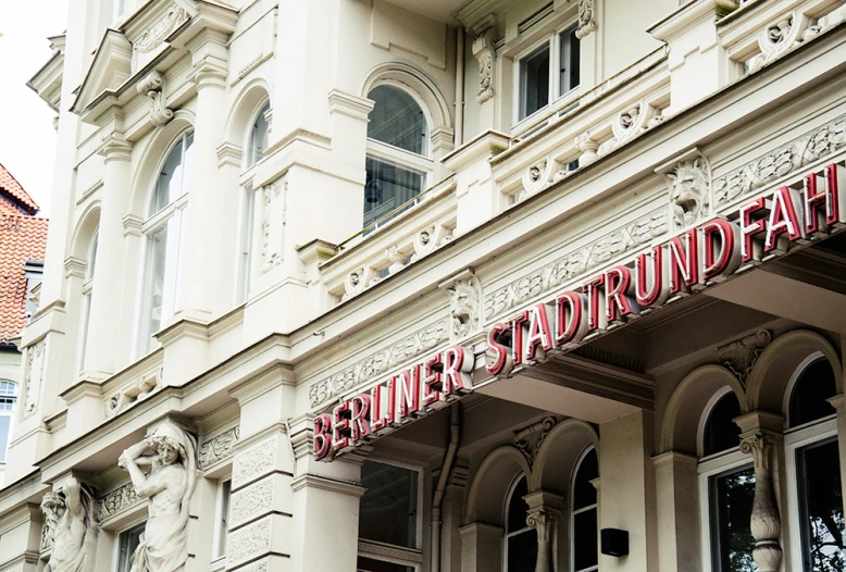 an image of a very old building with a very big sign on it