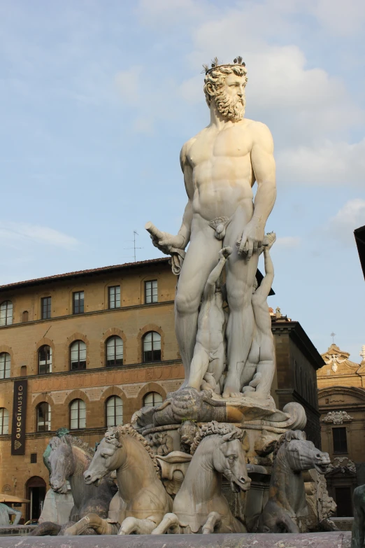 an image of a statues setting in front of the buildings