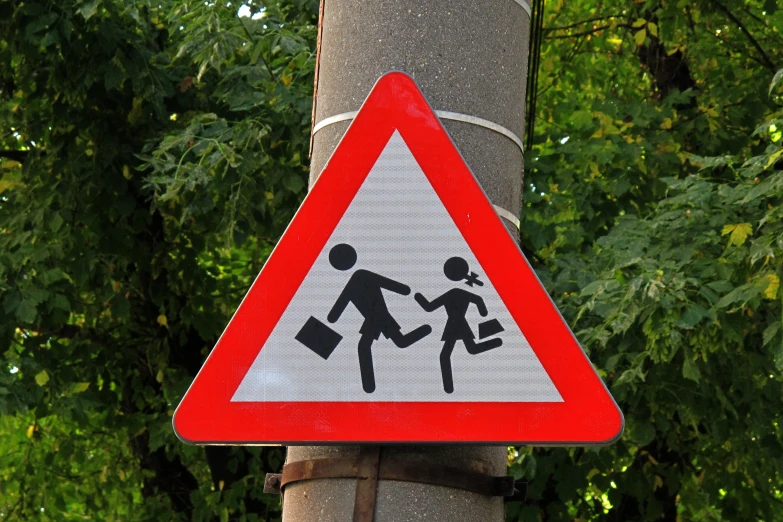 street sign displaying children crossing on both sides