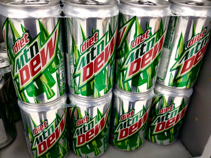 six cans of mountain dew are stacked up