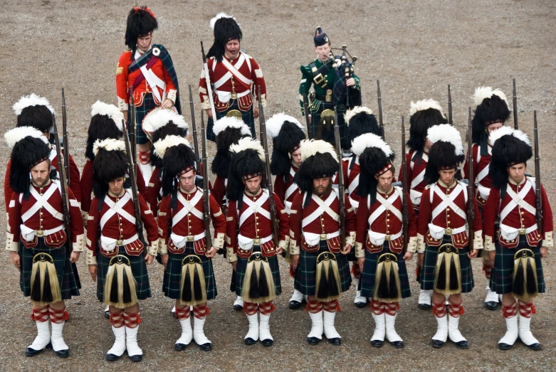 men in uniform wearing military gear, standing next to each other