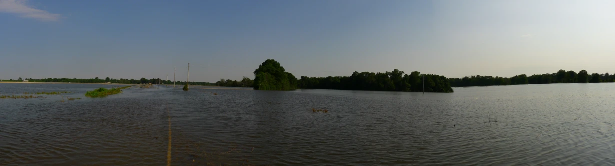 the river is about to fall down a tree lined bank