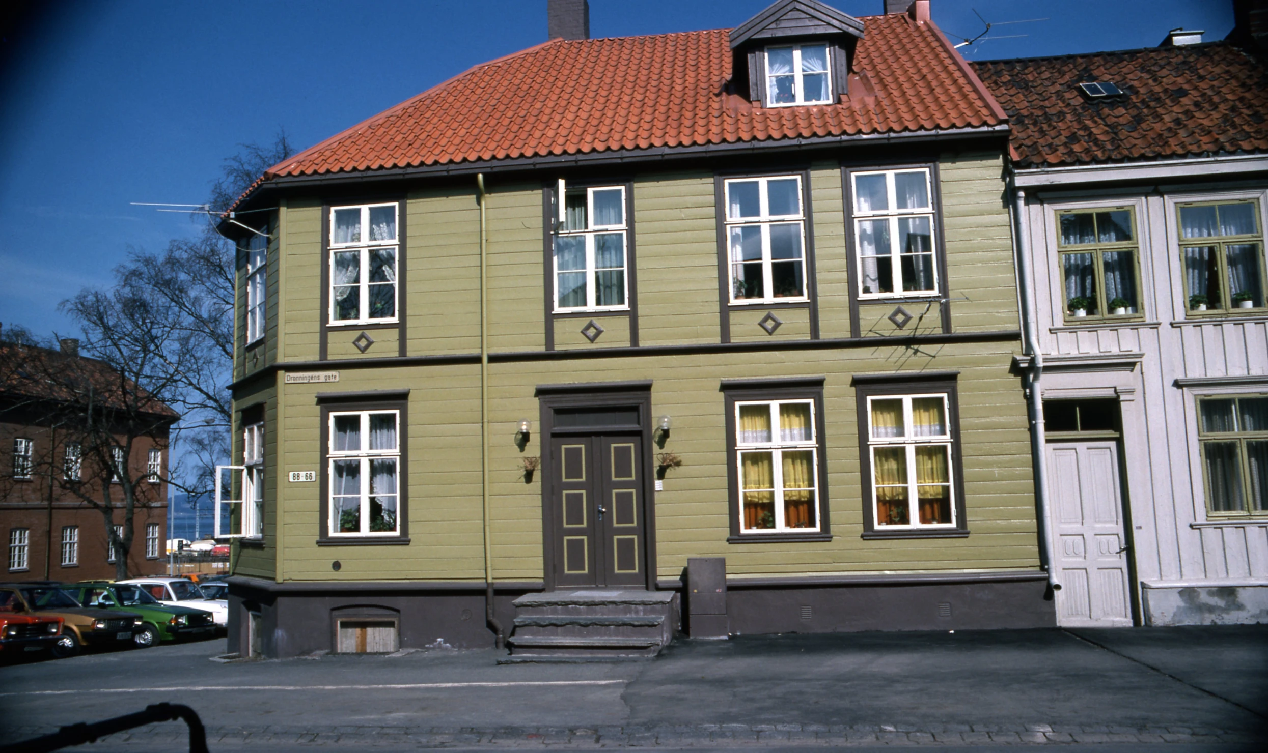 a brown building has lots of windows and doors